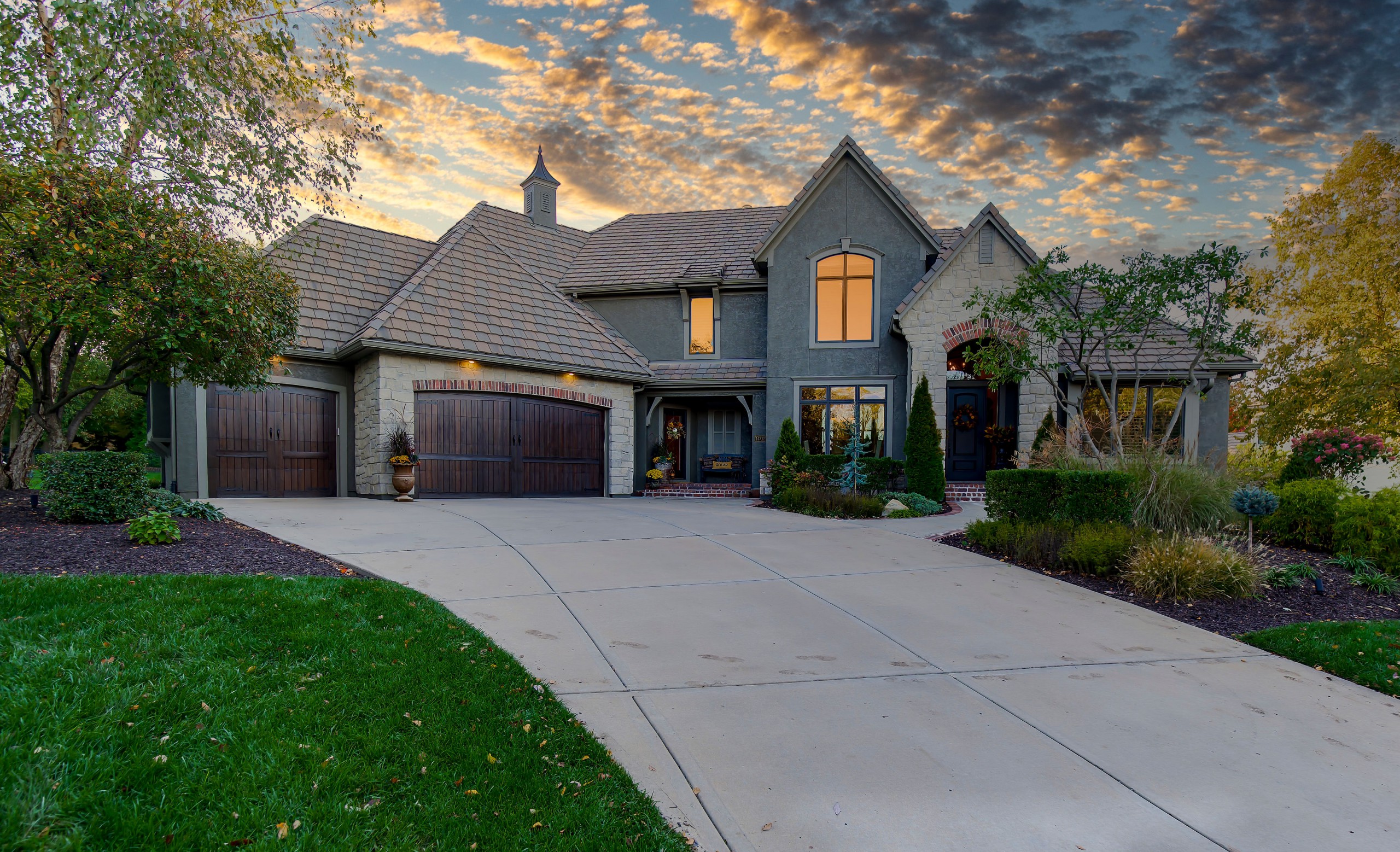 Gray brick home at sunset